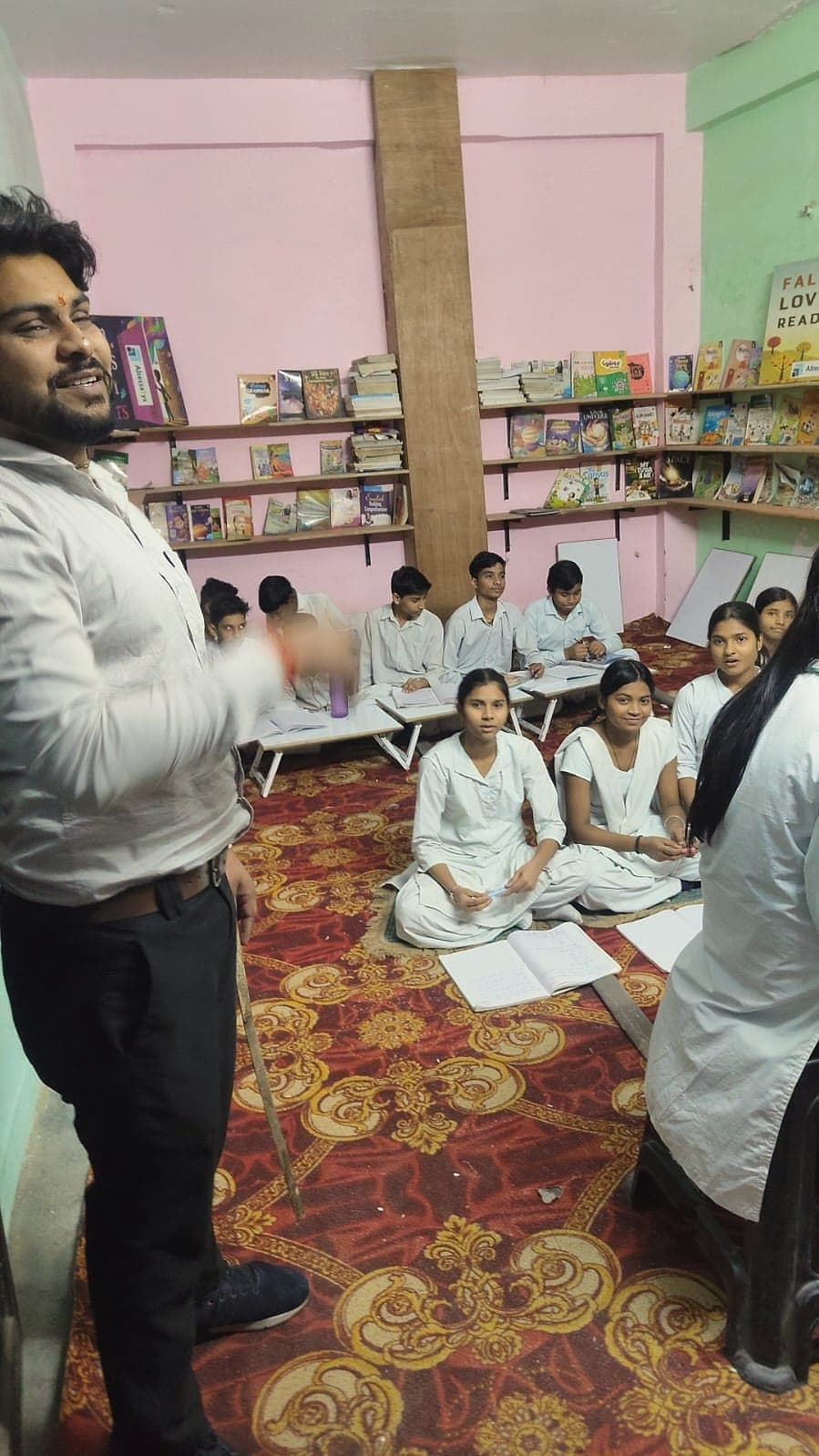 A weekend study circle seated on the floor of the centre
