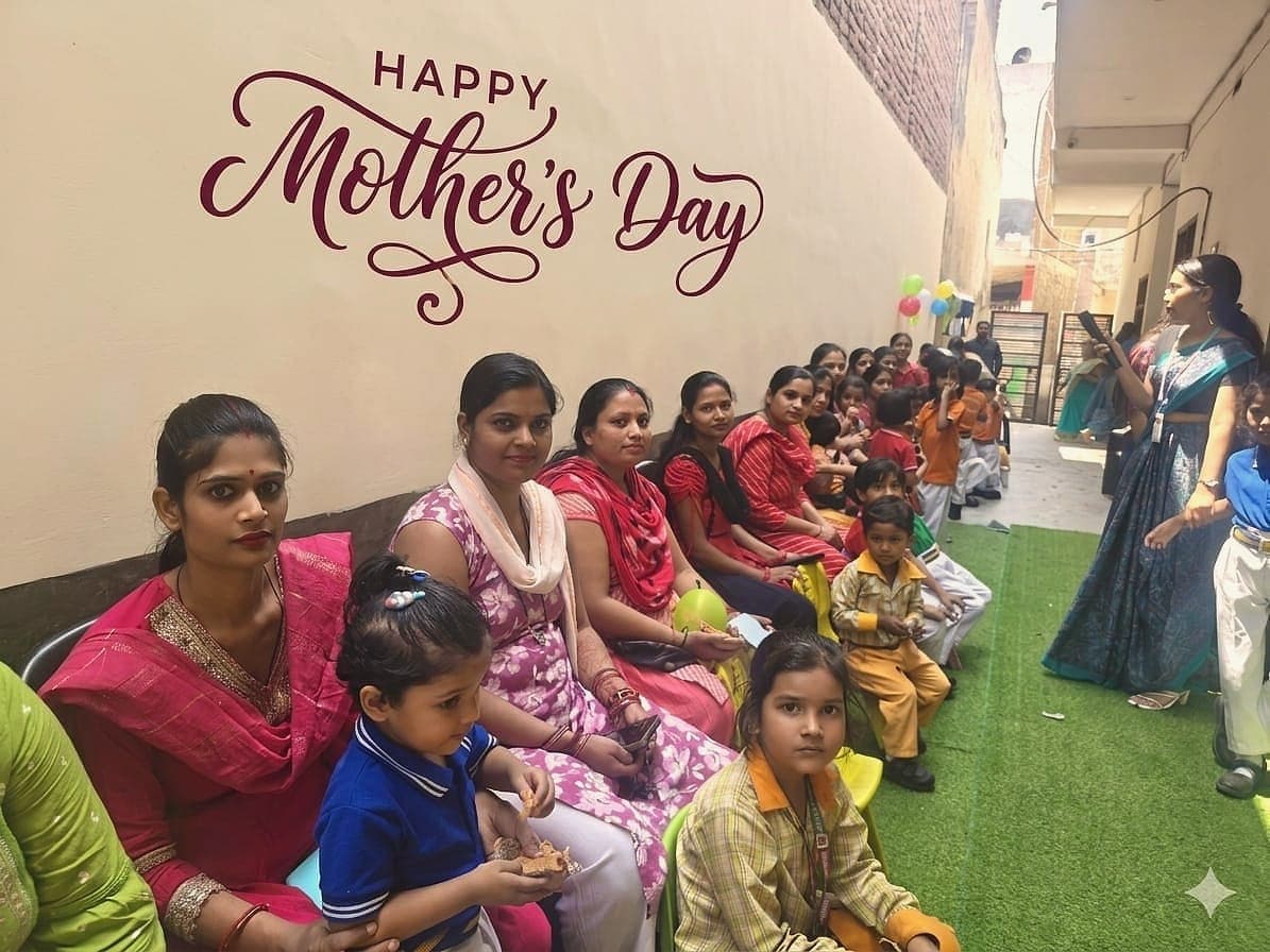 Mothers and children seated together at the centre's Mother's Day gathering